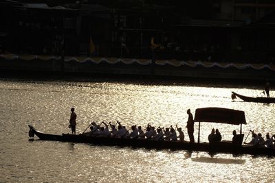 Group of people on boat in calm water