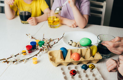 Children color eggs with food coloring. help mom get ready for easter