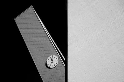 Low angle view of clock on wall