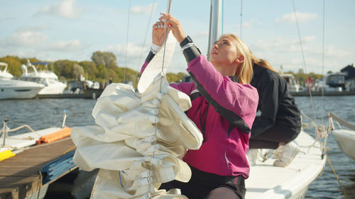 Sisters sitting on boat in water