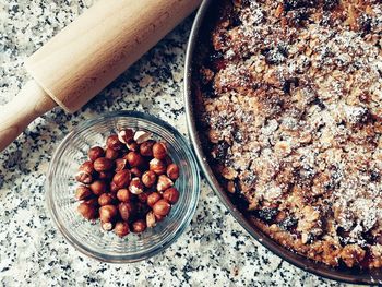 Directly above shot of dessert and nuts in marble