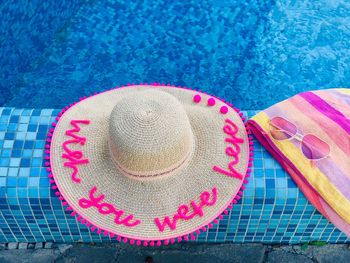High angle view of pink hat on swimming pool
