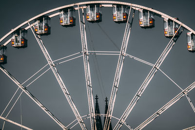 Low angle view of ferris wheel against sky