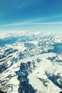 Scenic view of snow covered mountains against sky