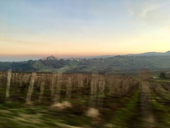 Scenic view of landscape against sky during sunset