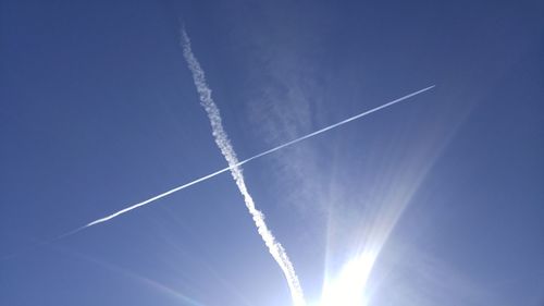 Low angle view of vapor trails in sky