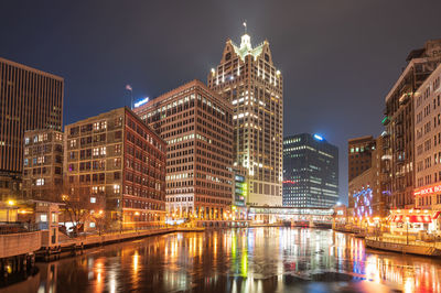 Illuminated buildings in city at night