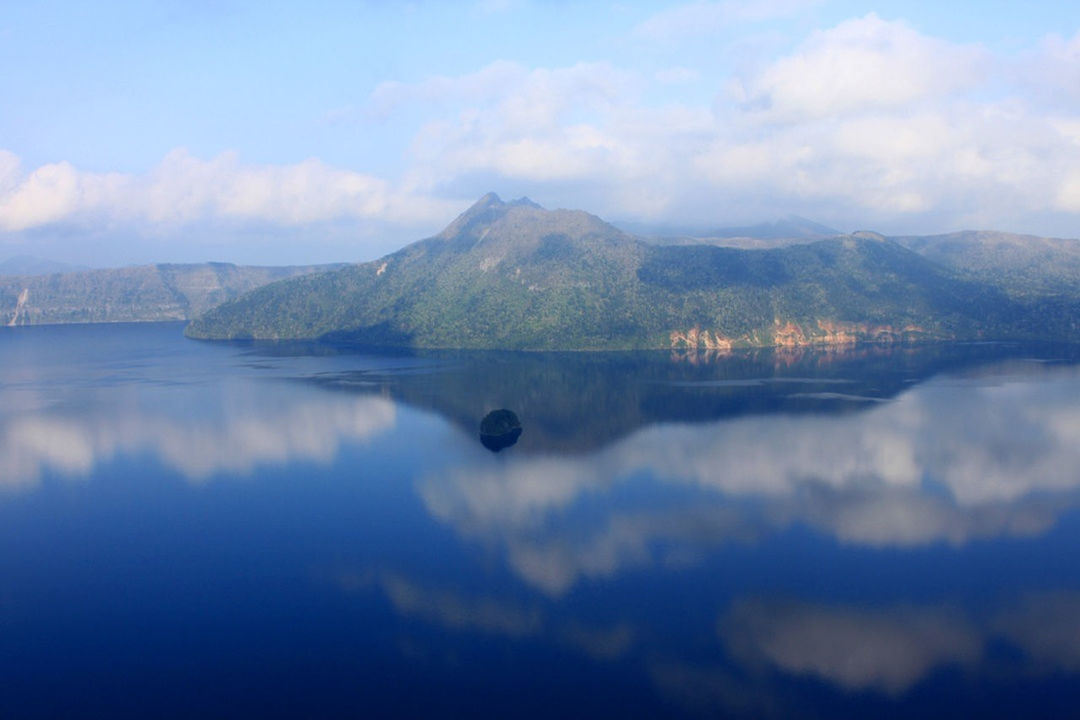 water, mountain, lake, tranquil scene, reflection, tranquility, scenics, sky, beauty in nature, mountain range, waterfront, cloud - sky, nature, cloud, standing water, idyllic, calm, non-urban scene, outdoors, majestic