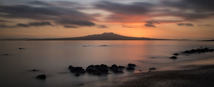 Scenic view of sea against sky during sunset