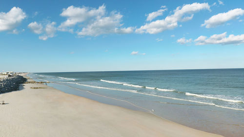 Scenic view of beach against sky