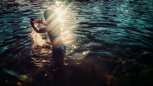 Young girl playing in water