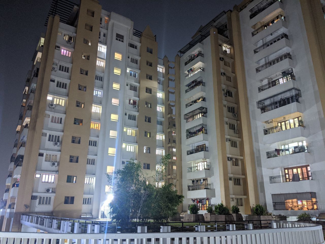 LOW ANGLE VIEW OF MODERN BUILDINGS AT NIGHT