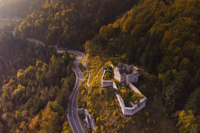 Aerial view of road amidst mountains against sky