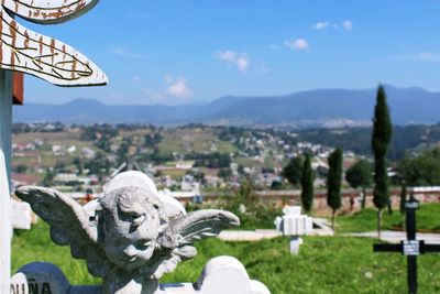 Statue of cityscape against sky