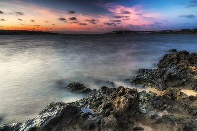 Scenic view of sea against sky during sunset