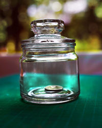 Close-up of glass jar on table