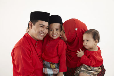 Happy family against white background