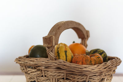 Close-up of orange fruits in basket