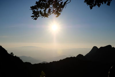 Scenic view of silhouette mountains against sky at sunset