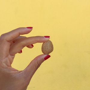 Close-up of hand holding ice cream cone