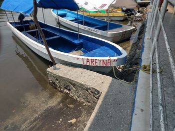 High angle view of fishing boats moored at harbor