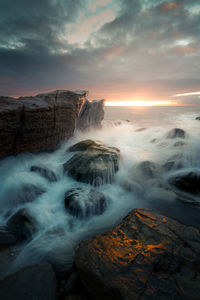 Scenic view of sea against sky during sunrise / sunset