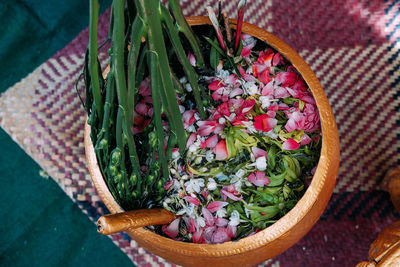 High angle view of flowering plant in basket on table