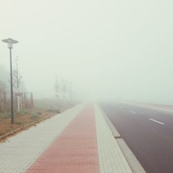 Empty road in foggy weather