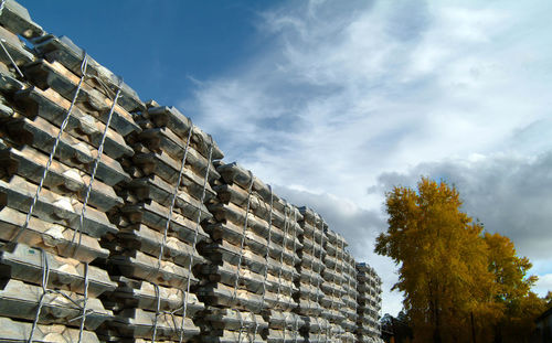 Low angle view of stack against sky