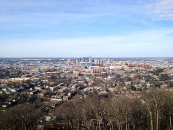 High angle view of buildings in city against sky