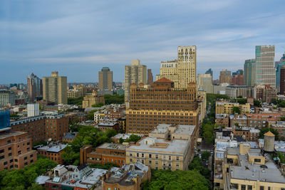 High angle view of buildings in city against sky