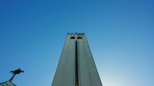 Low angle view of statue against clear blue sky