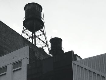 Low angle view of water tower against clear sky