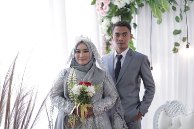 Young married couple standing on stage