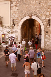 Group of people standing outside building