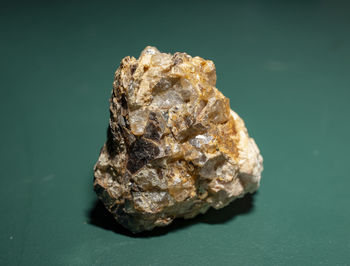 Close-up of a rock against blue background