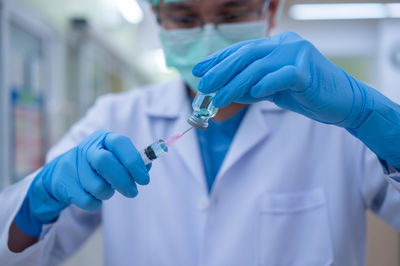 Midsection of man working in hospital