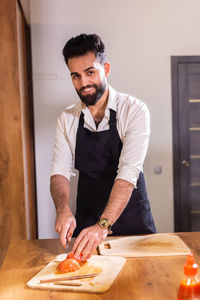 Portrait of young man working at home