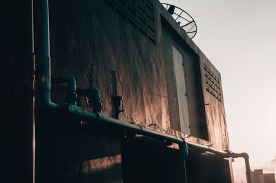 Low angle view of abandoned building against sky