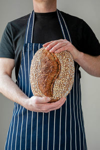 Midsection of man preparing food