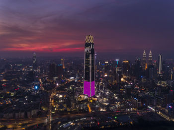 Illuminated buildings in city at night