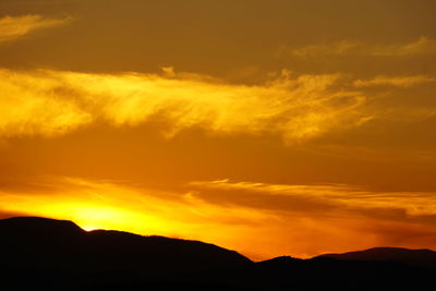 Low angle view of dramatic sky during sunset