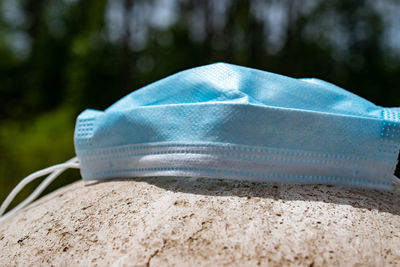 Close-up of shoes on sand