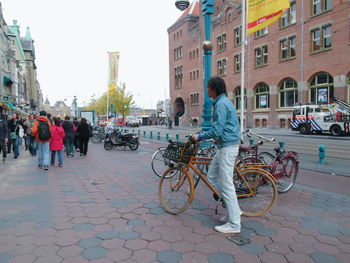 Full length of woman standing on city street