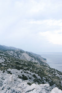 Scenic view of sea against sky during winter