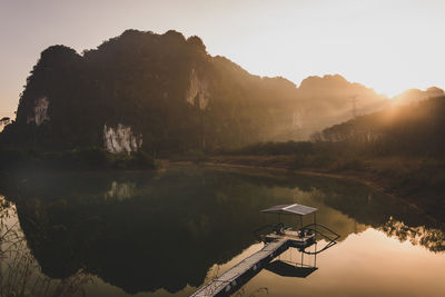 Scenic view of lake and mountains against sky