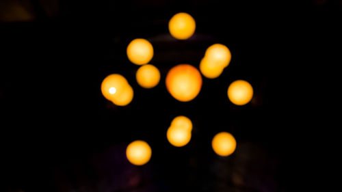 Close-up of yellow lights at night