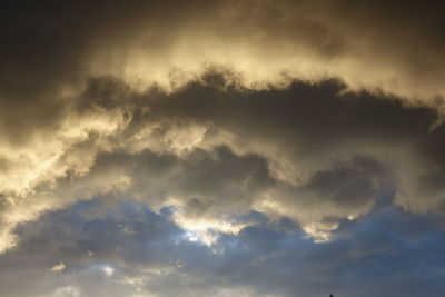 Low angle view of clouds in sky during sunset