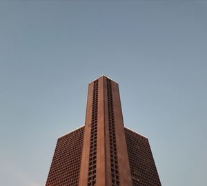 Low angle view of modern building against clear sky