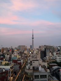 City skyline against cloudy sky